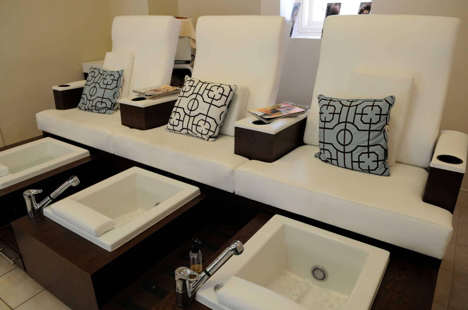 Pedicure chairs inside The Salon at The Peaks